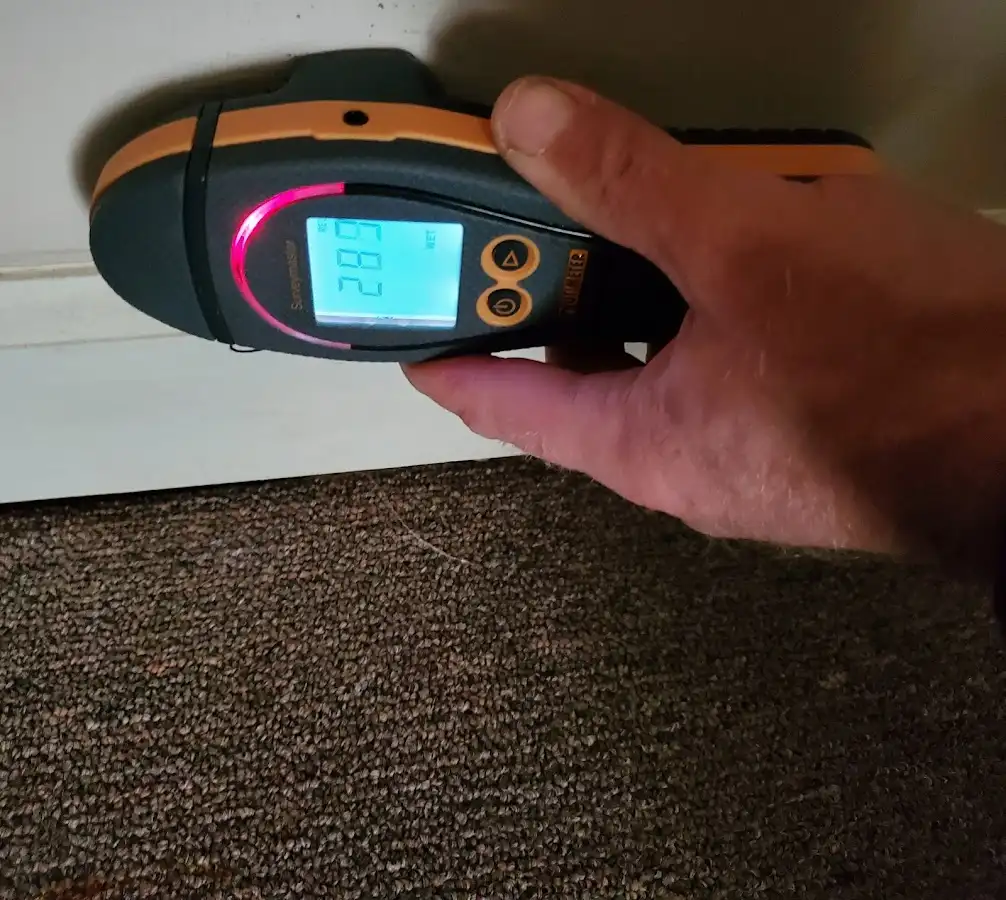 Moisture detection at baseboard during Storm Damage Restoration in Pasadena Hills